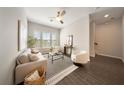 Bright living room featuring a neutral color palette, stylish furnishings, and lots of natural light at 450 Windmill Palm Cir, Altamonte Springs, FL 32701