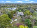 Expansive aerial view showcases the property's large lot and proximity to a picturesque lake at 500 Forest Lake Dr, Altamonte Springs, FL 32714