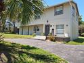 Charming home featuring a welcoming front porch with a decorated entranceway and well-kept lawn at 500 Forest Lake Dr, Altamonte Springs, FL 32714