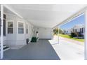 Exterior view of a single story home with an attached carport and garage at 519 Tivoli Park Dr, Davenport, FL 33897