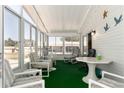 Sunroom with lots of windows and natural light, table and chairs at 519 Tivoli Park Dr, Davenport, FL 33897