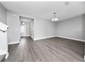 Bright living room with laminate flooring and open entry to front door at 5412 Caramella Dr, Orlando, FL 32829