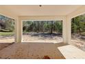 Covered back porch with an outdoor view of the backyard at 6551 Hemlock Rd, Ocala, FL 34472