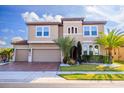 Charming two-story home boasts a well-manicured lawn and a three-car garage at 1720 Benoit Ter, Davenport, FL 33837