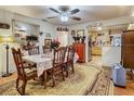 Inviting dining room featuring a floral tablecloth and a view of the kitchen at 2410 E Church St, Orlando, FL 32803