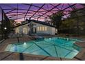 Screened-in pool and spa area with a spiral staircase adds luxury to this gorgeous outdoor space at 3326 Butler Bay N Dr, Windermere, FL 34786