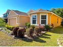 Lovely single-Gathering house boasting well-maintained landscaping and a welcoming facade at 3823 Ryegrass St, Clermont, FL 34714
