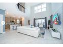 Bright living area with high ceilings, tile floors, and large windows filling the space with natural light at 4338 Rhyme St, Kissimmee, FL 34746