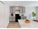 Modern kitchen with stainless steel appliances and granite countertops at 966 Sweetbrier Dr, Deltona, FL 32725