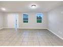 Bright and airy living room with sliding glass door and large windows at 987 Desert Candle Dr, Ocoee, FL 34761