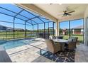 Screened lanai features a pool, hot tub, ceiling fan, and an outdoor seating area at 10732 Petrillo Way, Winter Garden, FL 34787