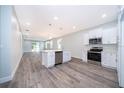 Spacious kitchen with a large island, stainless steel appliances, and open layout perfect for entertaining at 1104 Grove Manor Dr, Sanford, FL 32771