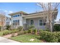 Beautifully landscaped front yard with a well-maintained lawn and a charming home exterior at 13759 Mommsen Ave, Orlando, FL 32827