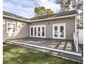 Spacious deck leading to a well-maintained yard, perfect for outdoor relaxation and entertainment at 1513 Pinecrest Pl, Orlando, FL 32803