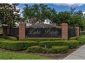 Entrance sign for Lake Pointe at Toho neighborhood surrounded by manicured landscaping and decorative brick at 2523 Water Valley Dr, St Cloud, FL 34771