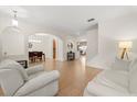 Open-concept living room with tile flooring and views of dining and seating areas at 4822 Lake Milly Dr, Orlando, FL 32839
