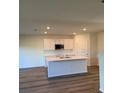 Modern kitchen with sleek countertops, stainless steel appliances, and a spacious island at 512 Coronado Cove Rd, New Smyrna Beach, FL 32168