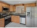 Updated kitchen with stainless steel appliances, granite countertops, and attractive backsplash at 126 Maitland Ave # 126, Altamonte Springs, FL 32701