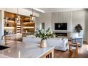 Modern living room with hardwood floors, a stylish fireplace, built-in bar, and comfortable seating, ideal for relaxation at 1402 Stetson St, Orlando, FL 32804