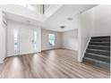 Bright entryway with wood floors, staircase, and lots of natural light at 181 Zachary Wade St, Winter Garden, FL 34787