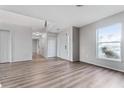 Spacious living room with wood floors, stairs, and bright natural light at 181 Zachary Wade St, Winter Garden, FL 34787