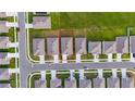 Aerial view of the property showcasing its location within a well-planned residential community with green spaces at 1811 Silverbell Loop, Haines City, FL 33844
