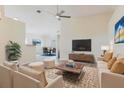 Stylish living room with modern furniture and decor, and a ceiling fan at 1832 Corner Meadow Cir, Orlando, FL 32820