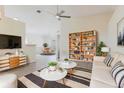 Bright living room featuring modern furniture, decor, and ceiling fan at 1832 Corner Meadow Cir, Orlando, FL 32820