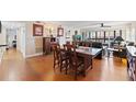 Open dining room flowing into a comfortable living space with hardwood flooring at 204 Quayside Cir # 501, Maitland, FL 32751