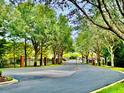 View of the community entrance with brick columns and secure gate at 2144 Rookery Ln, Sanford, FL 32773