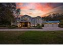 Gorgeous home with an expansive front lawn, showcasing its stunning architecture and well-maintained landscaping at 2240 W Dale Cir, Deland, FL 32720