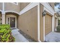 Close up of the home's entry, with a pathway leading to the front door and garage at 2804 Polvadero Ln # 107, Orlando, FL 32835