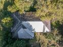 Birds eye view of roof design, surrounded by mature trees at 372 Carpenter Ave, Osteen, FL 32764