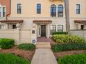 Inviting home exterior showcasing a secure entrance, tiled roof detail, and lush landscaping at 4504 Messina Dr, Lake Mary, FL 32746
