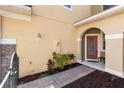 Home front door with covered porch, sidelight and brick paver walk at 5373 Via Appia Way, Sanford, FL 32771