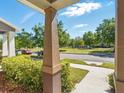 View from the porch of a green common area at 7776 Rigby St, Windermere, FL 34786