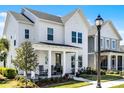 Attractive two-story home featuring a classic design, covered porch, and neatly maintained front yard at 1118 Eagles Pass Way, Winter Garden, FL 34787