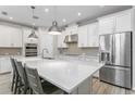 Spacious kitchen features a large center island, stainless steel appliances, and ample cabinet space at 115 E Concord St # 3, Orlando, FL 32801