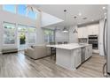Bright open-concept living space featuring a gourmet kitchen, high ceilings, and lots of natural light at 115 E Concord St # 3, Orlando, FL 32801