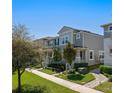 A townhome with neutral siding and manicured landscaping, nestled in a well-maintained neighborhood at 15926 Marina Bay Dr, Winter Garden, FL 34787