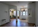 Inviting foyer with high ceilings, hardwood floors, decorative archways, and an ornate glass front door at 1924 Eloise Cove Dr, Winter Haven, FL 33884