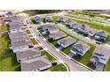 An aerial view of the property shows its location within a neighborhood of well-maintained homes and landscaping at 4032 Redbridge Loop, Davenport, FL 33837