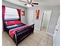Bedroom with bright window, neutral colors, and an en suite bathroom at 100 Huntswood Ct, Longwood, FL 32750