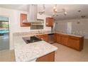 Modern kitchen with stainless steel appliances and granite countertops at 100 Huntswood Ct, Longwood, FL 32750