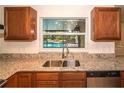 Kitchen featuring granite countertops, stainless appliances, and wooden cabinets at 100 Huntswood Ct, Longwood, FL 32750