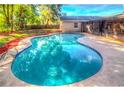 Sparkling in-ground pool in a private backyard setting at 100 Huntswood Ct, Longwood, FL 32750