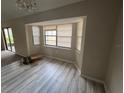 Dining room featuring bay window and sliding glass doors, filled with natural light at 1060 Walt Williams Rd, Lakeland, FL 33809