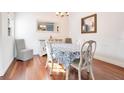 Well-lit dining room featuring hardwood floors, a large mirror, and a dining table with seating at 1290 Grady Ln # 20232, Davenport, FL 33896