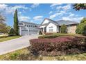 Beautiful two-story home with a three-car garage, nice landscaping and driveway at 1403 Lake Whitney Dr, Windermere, FL 34786