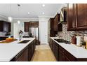 Spacious kitchen with a large island, modern appliances, and ample counter space for cooking at 14090 Alafaya Oak Bnd, Orlando, FL 32828